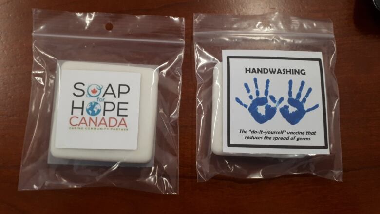 A bar of soap and a hand-washing kit, labeled "Soap for Hope"